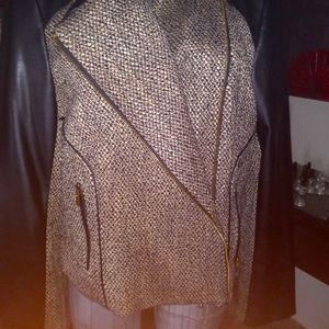 This is a lovely leather and wool jacket by Calvin Klein size 14 never been worn